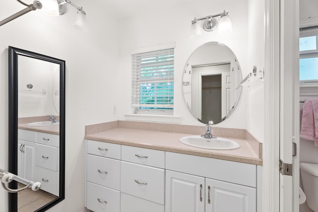 bathroom featuring vanity and toilet