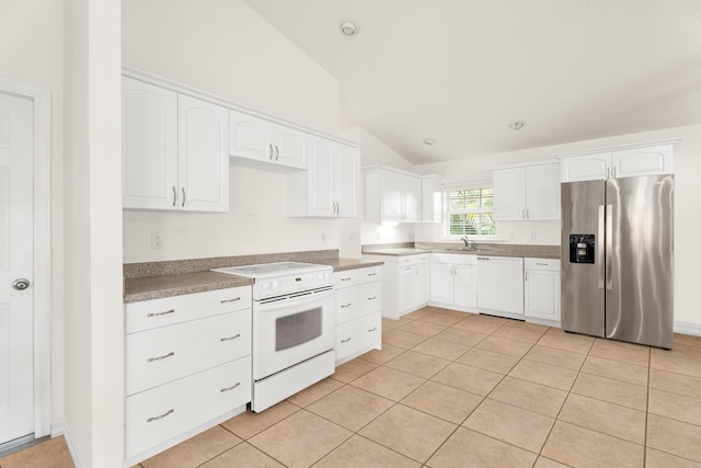 kitchen featuring white cabinets, light tile patterned floors, white appliances, and vaulted ceiling