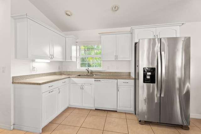 kitchen with white cabinets, sink, white dishwasher, and stainless steel refrigerator with ice dispenser