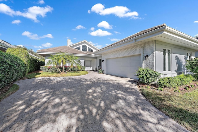 single story home featuring a garage