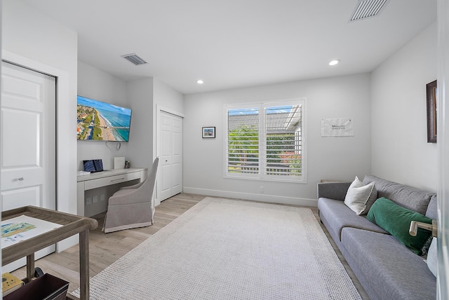 office area with light hardwood / wood-style floors