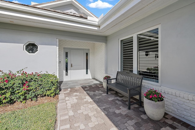 entrance to property featuring a patio area