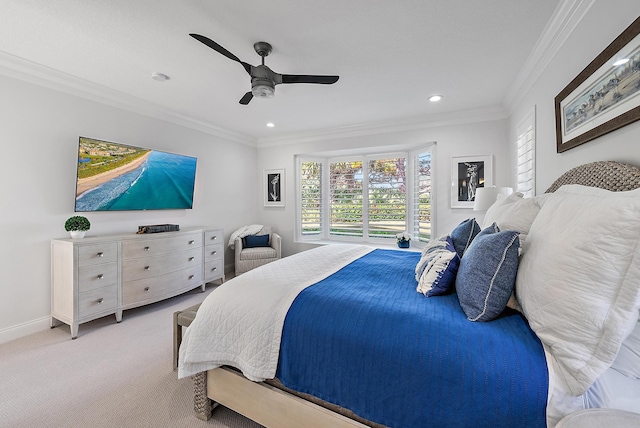 carpeted bedroom featuring ceiling fan and ornamental molding