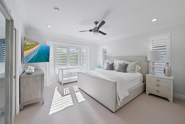 bedroom featuring multiple windows, ceiling fan, and crown molding