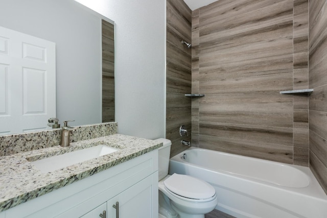 full bathroom with vanity, toilet, and tiled shower / bath