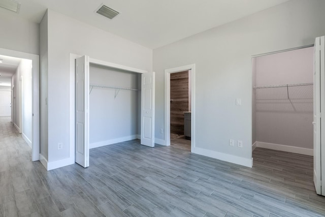 unfurnished bedroom featuring light wood-type flooring