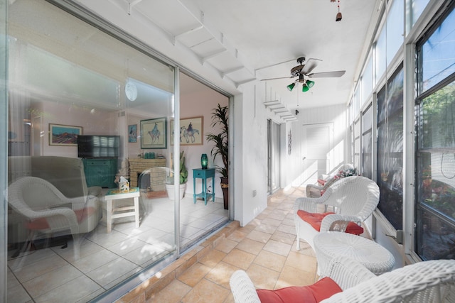 sunroom / solarium with ceiling fan