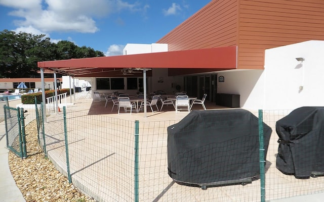 view of patio featuring a grill and ceiling fan