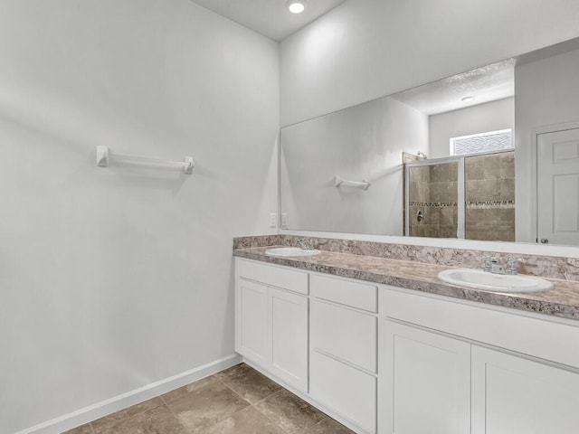 bathroom with vanity and walk in shower