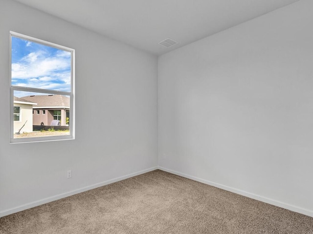 unfurnished room featuring carpet floors