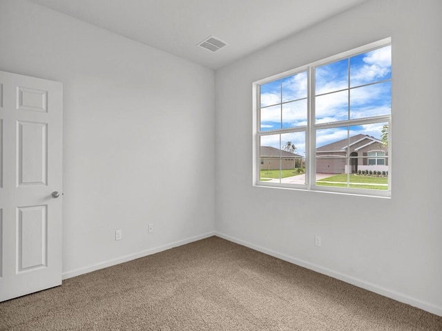 empty room with carpet flooring