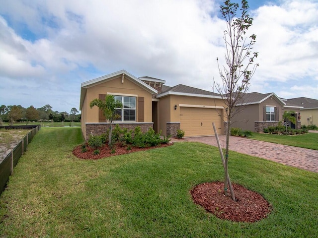 view of front of house with a front yard and a garage