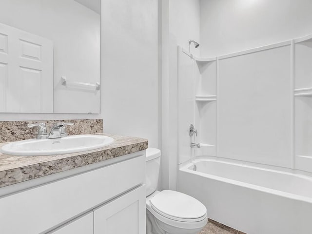 full bathroom featuring vanity, bathtub / shower combination, and toilet