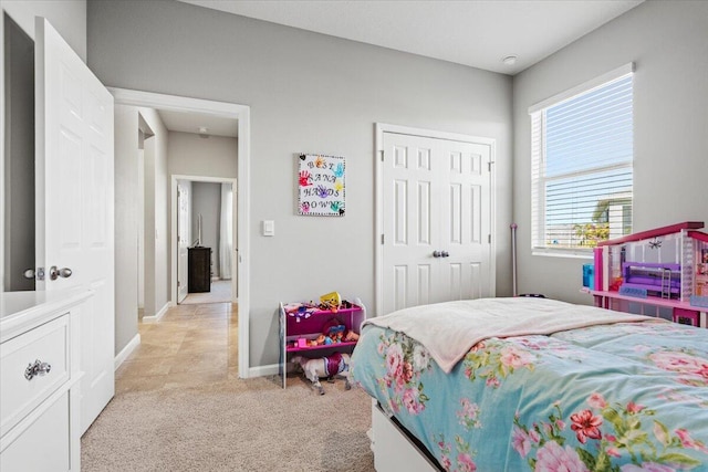 carpeted bedroom featuring a closet