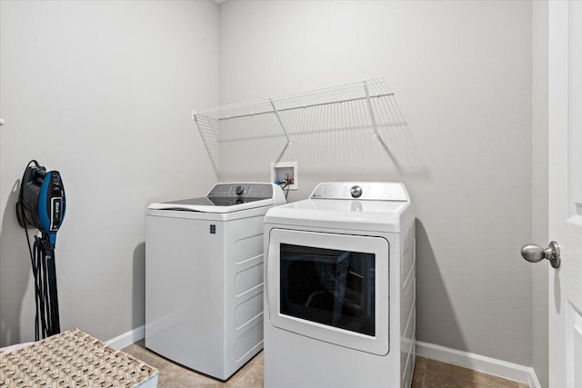 clothes washing area featuring independent washer and dryer