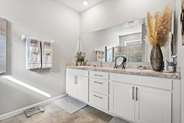 bathroom featuring vanity and walk in shower