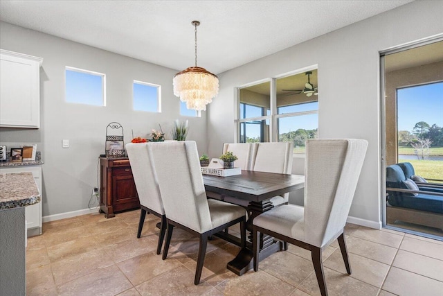 dining area with a notable chandelier and a healthy amount of sunlight