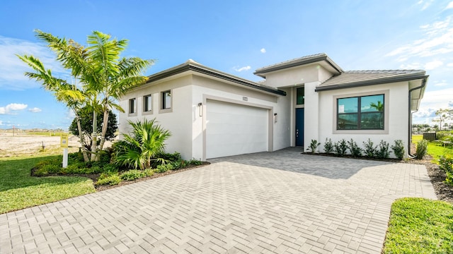 view of front of property with a garage