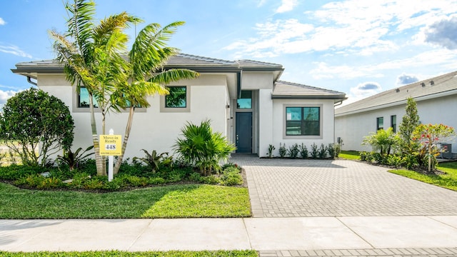 view of front of home with a front lawn