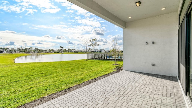 view of patio with a water view