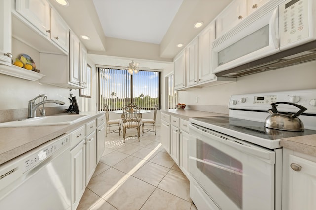 kitchen with ceiling fan, sink, white cabinets, white appliances, and light tile patterned floors