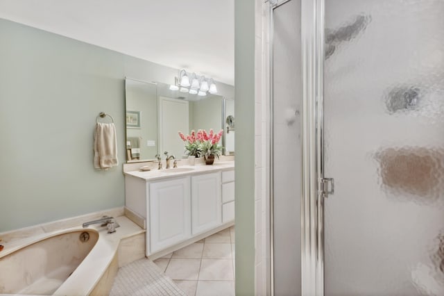 bathroom with vanity, tile patterned flooring, and plus walk in shower