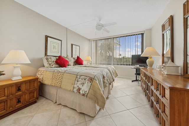 tiled bedroom with ceiling fan