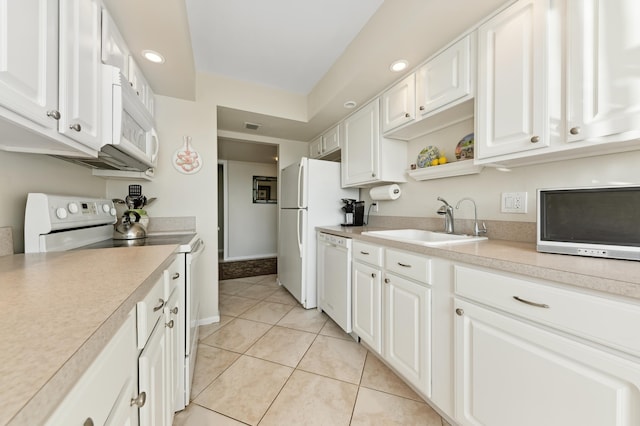 kitchen featuring white cabinetry, white appliances, sink, and light tile patterned floors