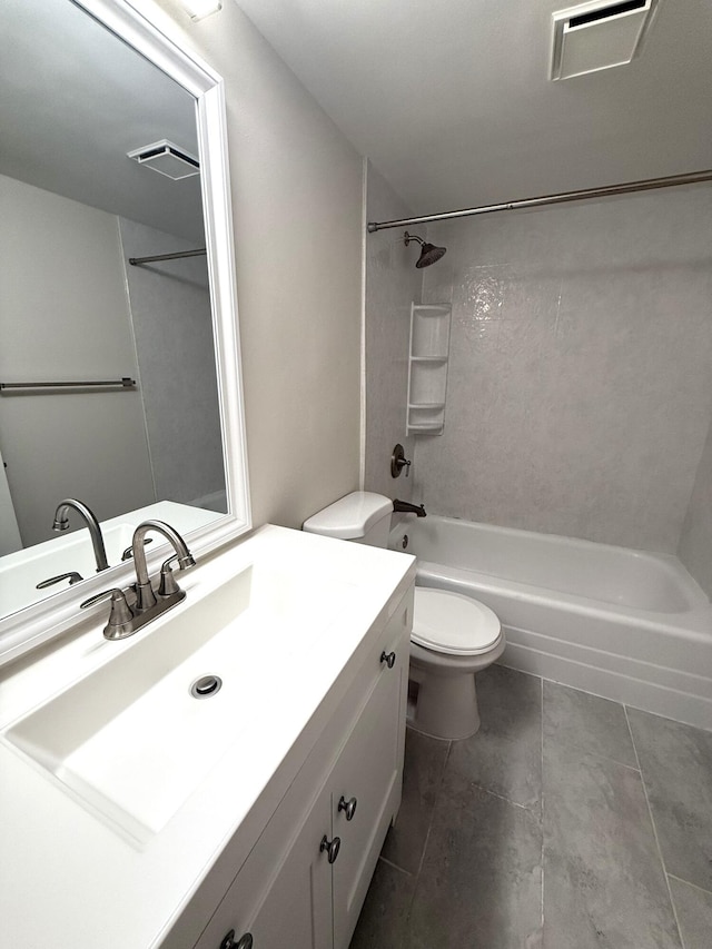 full bathroom featuring tiled shower / bath, vanity, and toilet