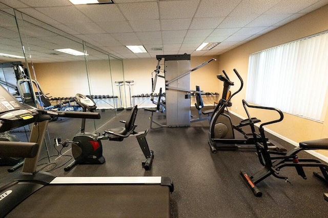 gym featuring a paneled ceiling