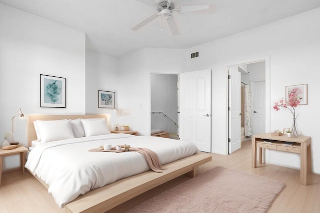 bedroom featuring ensuite bathroom, ceiling fan, and light wood-type flooring