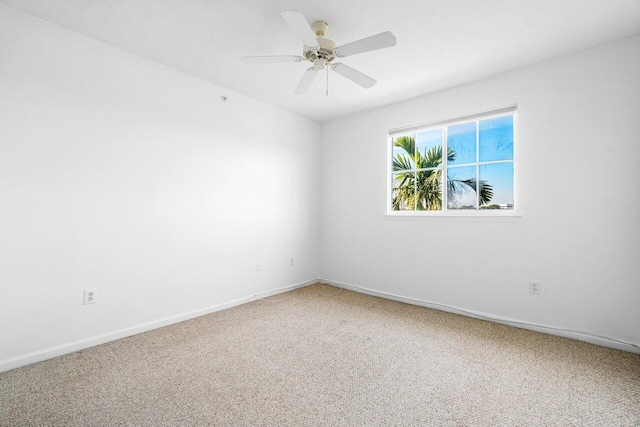 unfurnished room with carpet floors and ceiling fan