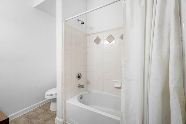 bathroom featuring toilet and shower / tub combo with curtain