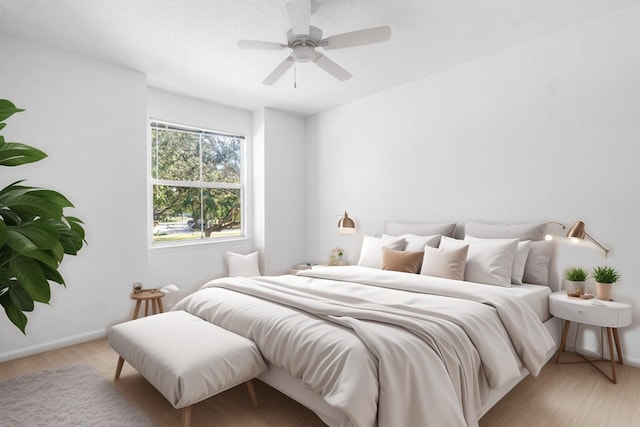 bedroom with ceiling fan and light wood-type flooring