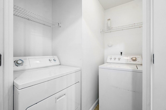 clothes washing area featuring washing machine and dryer