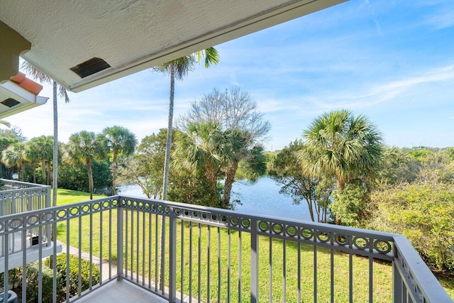 balcony featuring a water view