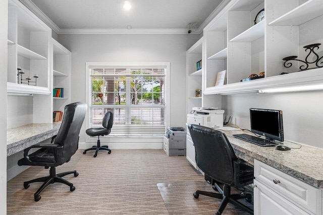 home office featuring built in desk and ornamental molding