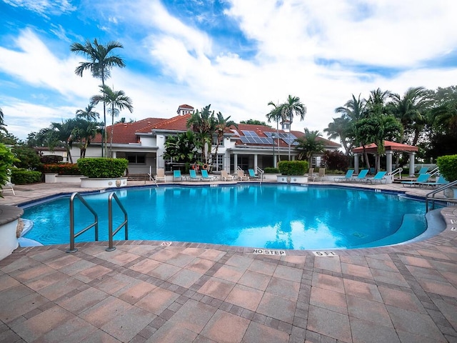 view of swimming pool featuring a patio area