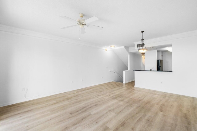 unfurnished living room featuring light hardwood / wood-style flooring, ceiling fan, and ornamental molding