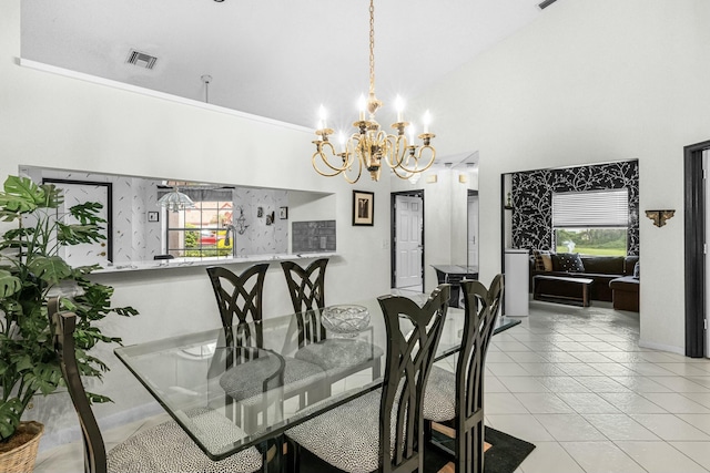 dining area featuring light tile patterned flooring, a towering ceiling, and an inviting chandelier