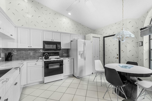 kitchen featuring light stone countertops, white cabinetry, pendant lighting, and white appliances