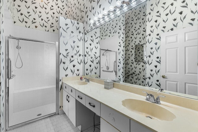 bathroom with tile patterned floors, vanity, and a shower with shower door