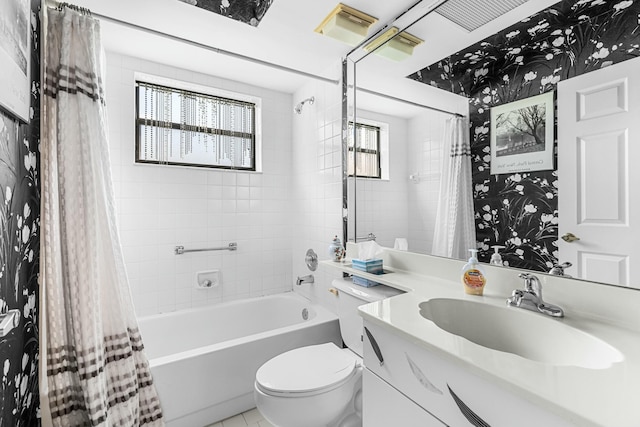 full bathroom featuring vanity, toilet, and shower / bath combo