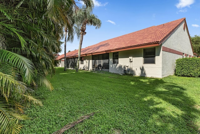 back of house featuring a yard