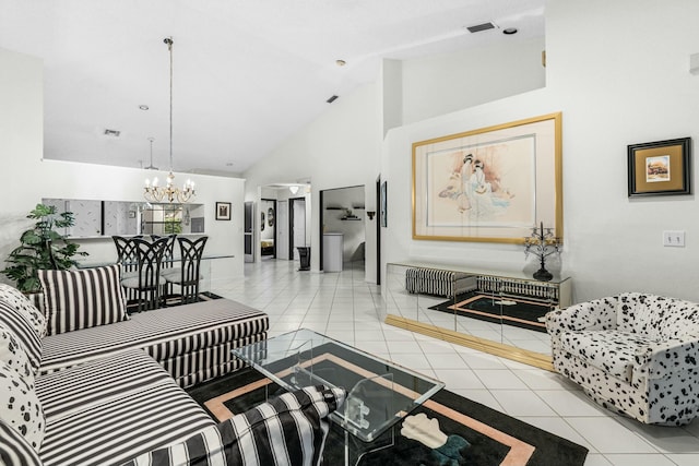 tiled living room featuring high vaulted ceiling and a chandelier