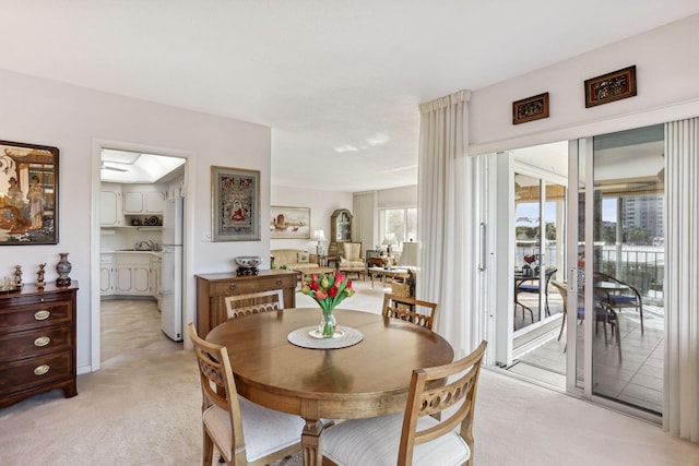 view of carpeted dining space