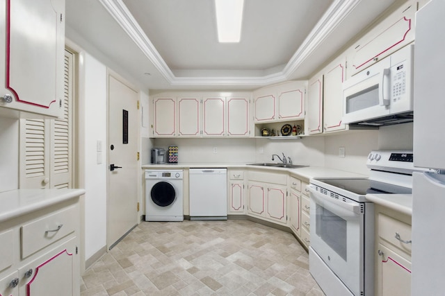 kitchen with white cabinetry, sink, white appliances, washer / dryer, and a tray ceiling