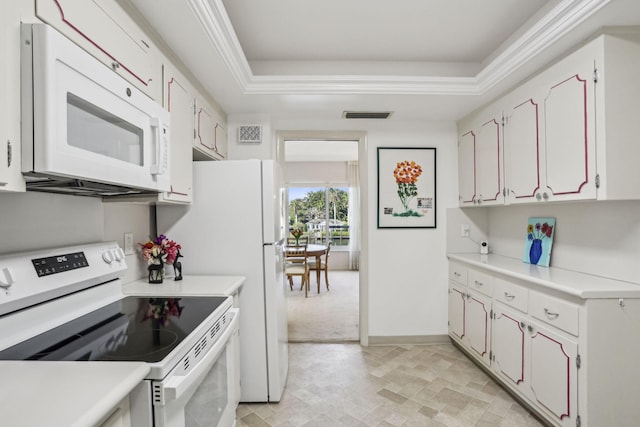 kitchen featuring a tray ceiling, white cabinets, white appliances, and ornamental molding