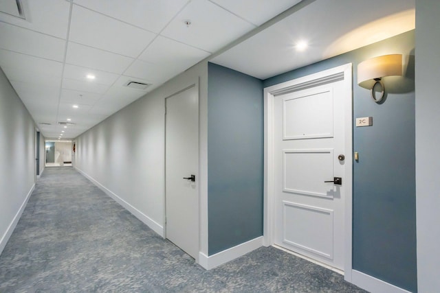 hallway featuring a paneled ceiling