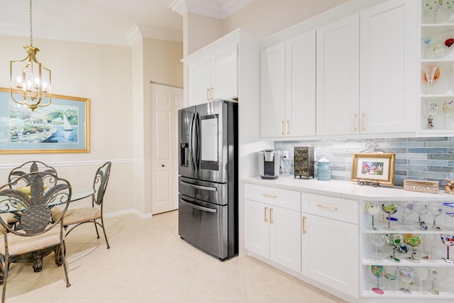 kitchen featuring white cabinetry, stainless steel fridge with ice dispenser, hanging light fixtures, and an inviting chandelier